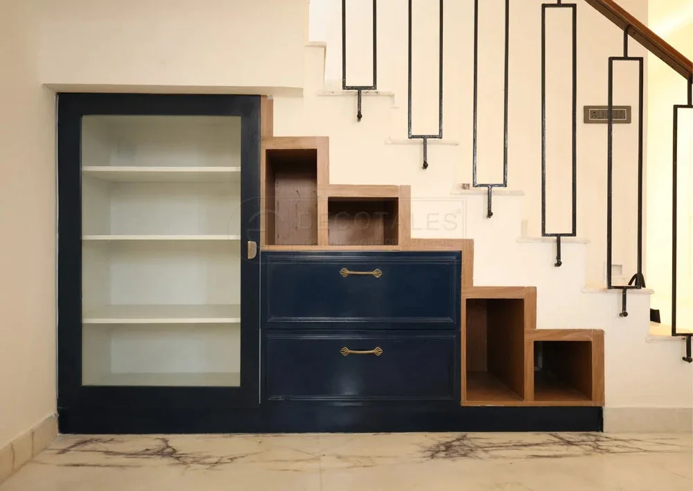 Decotales custom under-stair storage with drawers, open shelves and a display cabinet
