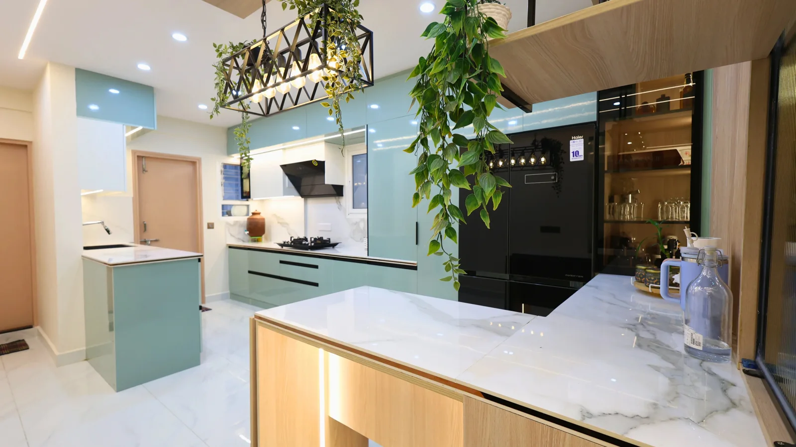 Decotales renovation project: mint cabinetry, marble counters and integrated storage
