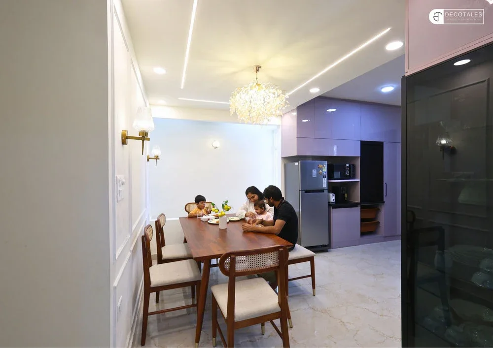 A family sharing a meal in their Decotales-designed dining space
